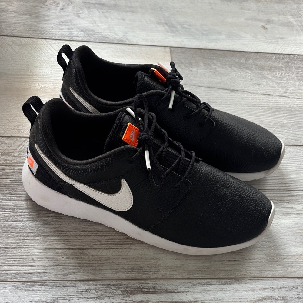 Nike Black Sneakers with White and Orange Details